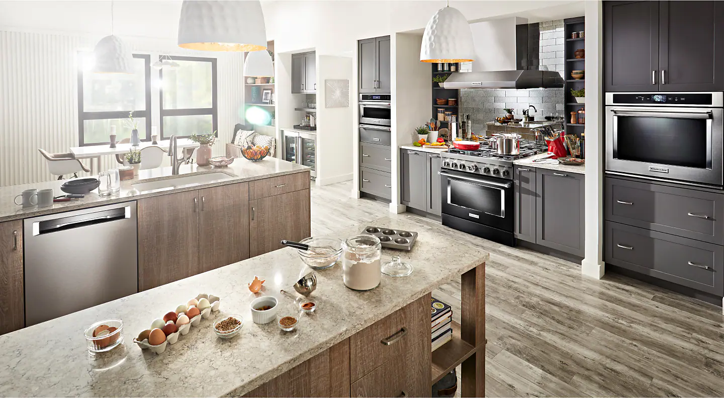Modern kitchen with ingredients spread out on an island countertop Modern kitchen with ingredients spread out on an island countertop