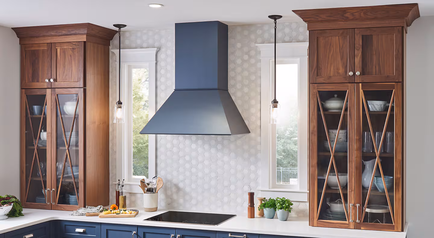Wall-mount range hood over an electric cooktop Wall-mount range hood over an electric cooktop
